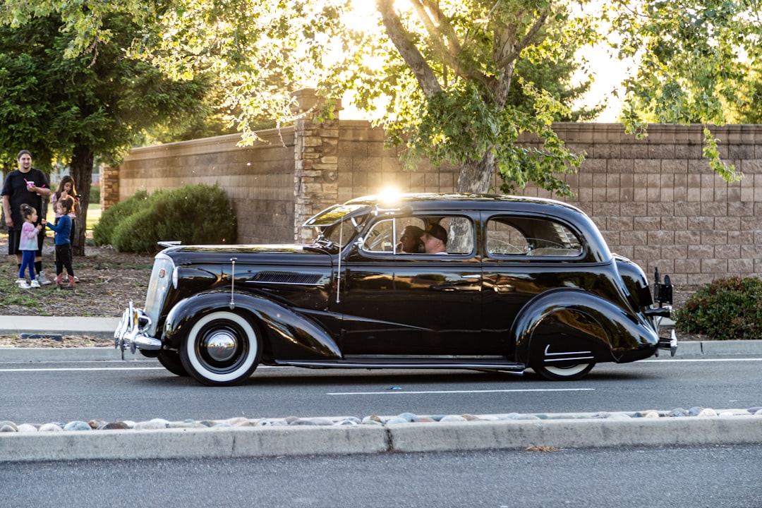 black vintage car on road during daytime